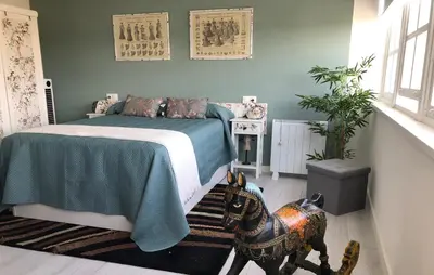 a bedroom with a bed and a horse in it at Estudios rúa Maior, 49-2B in Sarria