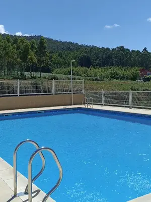 a large swimming pool with blue water at AYE Catedrales in Barreiros