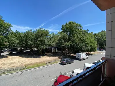 a view from a balcony of a street with cars parked at Carballeira in Moraña