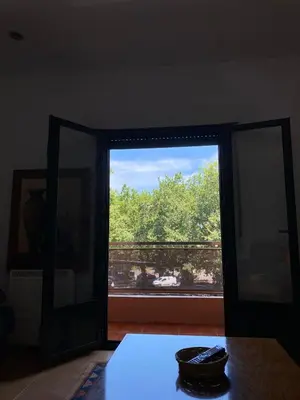 a window in a room with a table and a view at Carballeira in Moraña