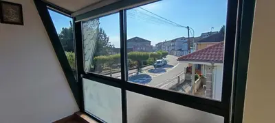 a view from a window of a street at As Lamelas in Cea