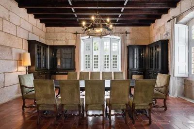 a dining room with a table and chairs at Casa Palacio Ribeira Sacra in Esgos