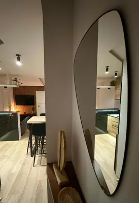 a mirror on a wall next to a living room at Kilometro 22 Luxury in Padrón