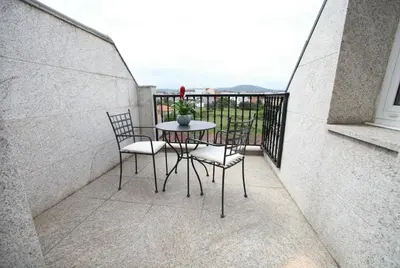 a table and chairs on a balcony with a view at Hotel Ribeira Sacra in Monforte de Lemos