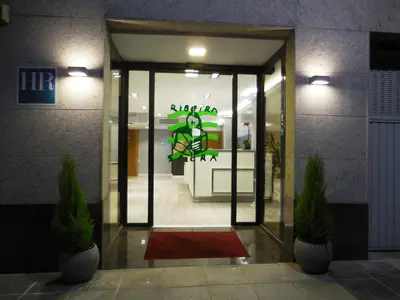 a entrance to a building with a sign on the door at Hotel Ribeira Sacra in Monforte de Lemos