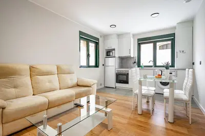 a living room with a couch and a table at Apartamentos Marta in Ribadeo