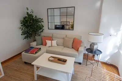 a living room with a couch and a table at Travesa in Betanzos