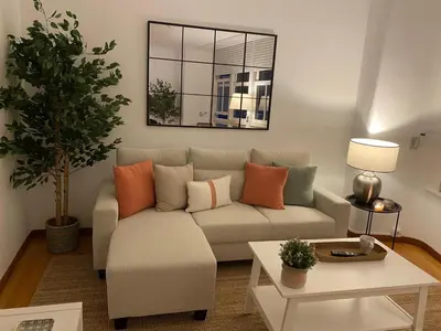 a living room with a couch and a table at Travesa in Betanzos