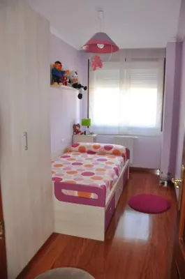 a small bedroom with a bed in a room at Katxutxa El corazon de Galicia in Lalín