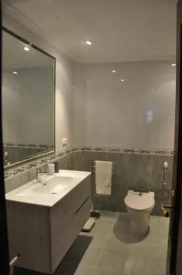 a bathroom with a sink and a toilet at Katxutxa El corazon de Galicia in Lalín
