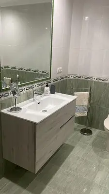 a bathroom with a white sink and a mirror at Katxutxa El corazon de Galicia in Lalín