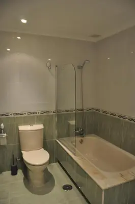 a bathroom with a toilet and a bath tub at Katxutxa El corazon de Galicia in Lalín