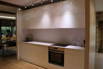 a kitchen with white counters and a stove top oven at Luxury Pombar in Ourense