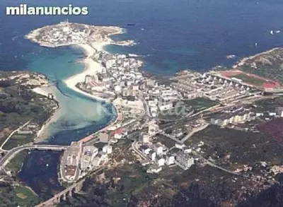 an aerial view of a city and the ocean at Piso cerca de la playa, dos habitaciones, piscina y terraza in San Ciprián