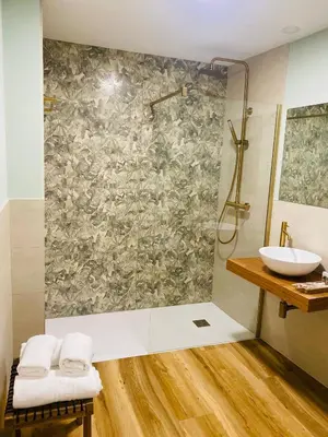 a bathroom with a shower and a sink at Apartamentos Buenos Aires,en el centro de Ribadeo con vistas a la ría in Ribadeo