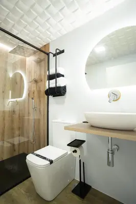 a bathroom with a toilet and a sink at as Alvarizas in Moraña
