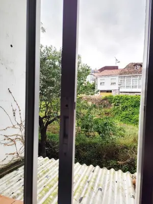 an open door with a view of a yard at Piso de Alba in Chantada