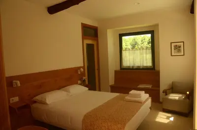 a bedroom with a bed and a window at Casa do Cereiro in A Estrada