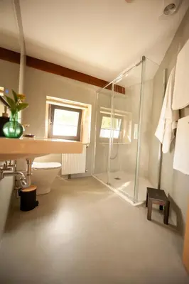 a bathroom with a shower and a toilet and a sink at Casa do Cereiro in A Estrada