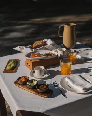 a table with plates of food on top of it at Pazo Arretén in Padrón