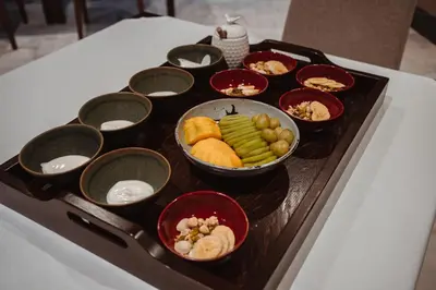 a tray of food on a table with bowls of food at Pazo Arretén in Padrón