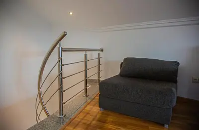a staircase with a metal railing and a stair case at Mirador del Camino in Melide
