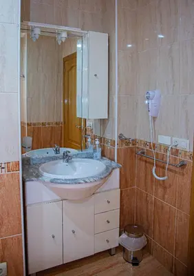 a bathroom with a sink and a mirror at Mirador del Camino in Melide