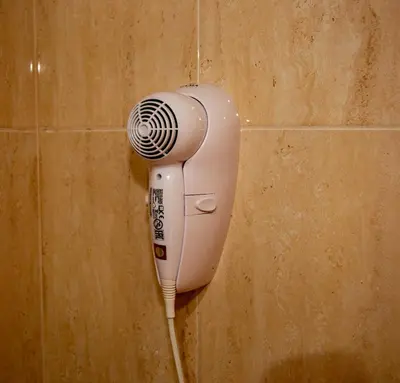a hair dryer is hanging on a wall at Mirador del Camino in Melide