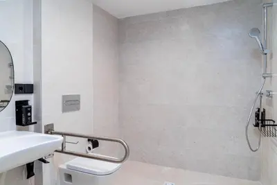 a bathroom with a sink and a shower at Limehome Santiago de Compostela in Santiago de Compostela