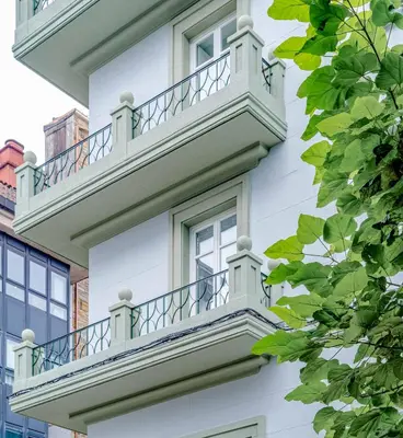 a white building with balconies on the side of it at Limehome Santiago de Compostela in Santiago de Compostela