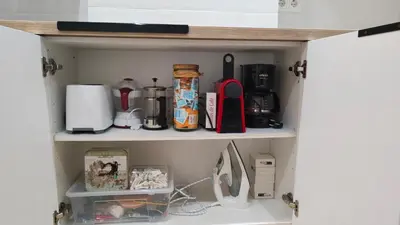 a cupboard with various items on it at Apartamento La Ribera in Betanzos