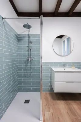 a bathroom with blue subway tiles and a shower at Apartamentos Bágoas de Mencía Peares Ribeira Sacra in Carballedo