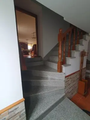a stairway in a house with a stair case at Casa en zona rural in Cervo