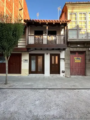 a house with a balcony on the side of it at Carud Nº15 in Monforte de Lemos