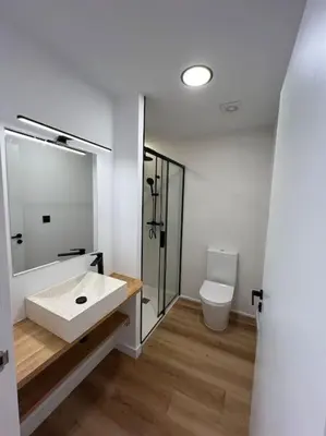 a bathroom with a sink and a toilet at Carud Nº15 in Monforte de Lemos