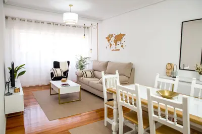 a living room with a couch and a table at Home Ourense Miño in Ourense