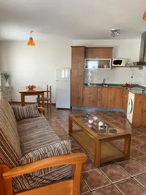 a living room with a couch and a table at A Xanuca in Taramundi