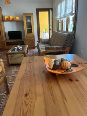 a living room with a table with a plate on it at A Xanuca in Taramundi