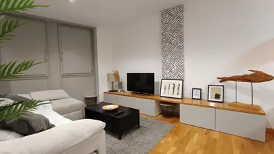 a living room with a white couch and a television at Orballo in Ourense