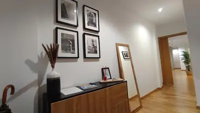 a room with a dresser and pictures on the wall at Orballo in Ourense