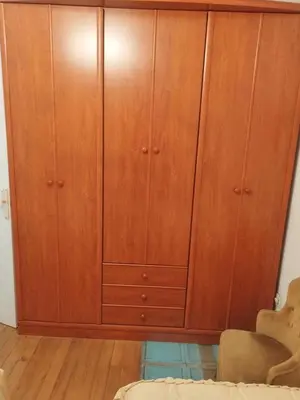 a large wooden cabinet in a living room at Acogedora casa a pie de playa in Cillero