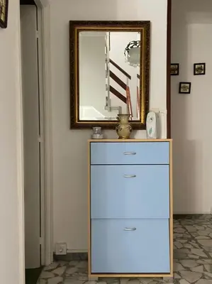 a dresser in a room with a mirror at Acogedora casa a pie de playa in Cillero