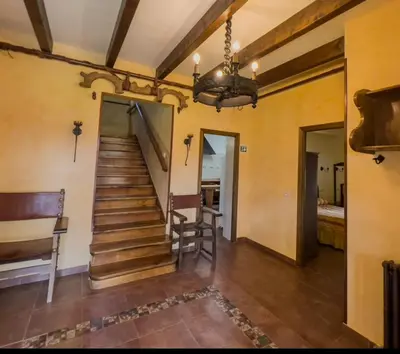 a hallway with a staircase in a house at Casa Rural LOS MILLARES in Ribadelago