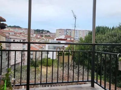 a balcony with a view of a city at Calpurnia Abana in Ourense