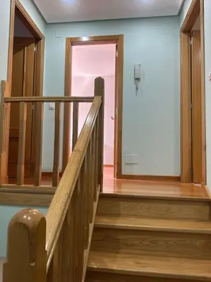 a staircase leading to a door in a building at Increíble dúplex en Lugo in Lugo