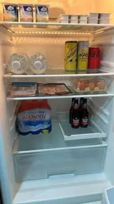 an open refrigerator filled with food and drinks at Increíble dúplex en Lugo in Lugo