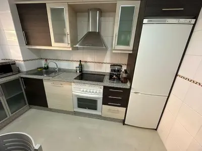 a small kitchen with a sink and a refrigerator at Increíble dúplex en Lugo in Lugo
