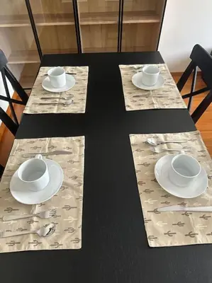 a table with plates and cups on top of it at Increíble dúplex en Lugo in Lugo