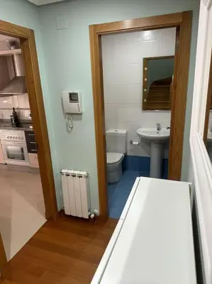 a bathroom with a toilet and a sink at Increíble dúplex en Lugo in Lugo