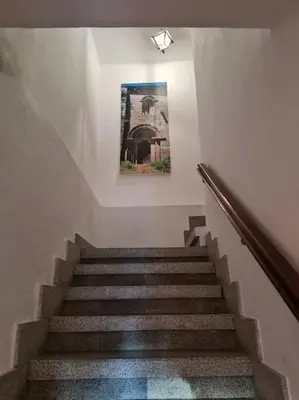a stairway with a picture hanging on the wall at Casa San Miguel in Chantada